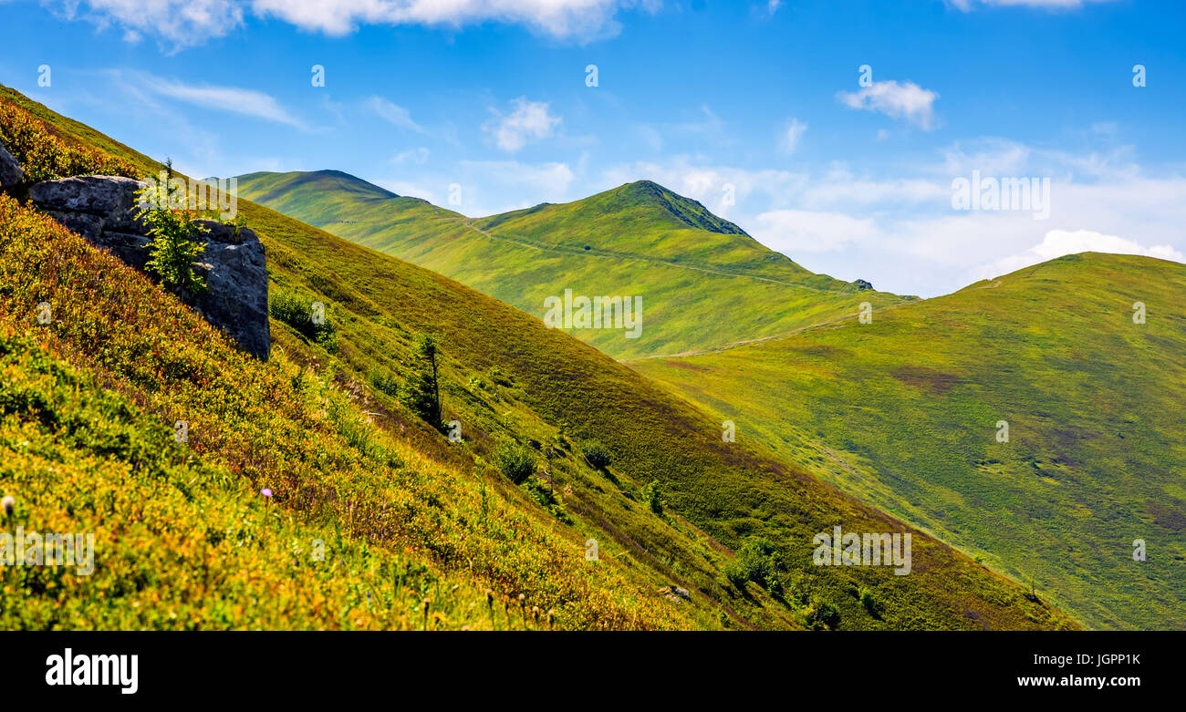 mountain ridge with peak behind the hillside. beautiful summer background Stock Photo