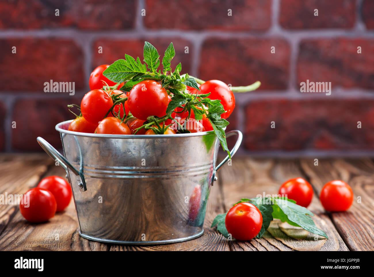 tomato cherry in bowl and on a table Stock Photo - Alamy
