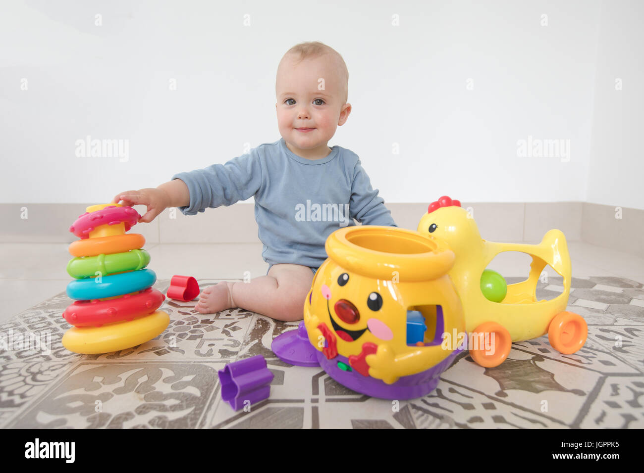 Baby play with pyramid Stock Photo