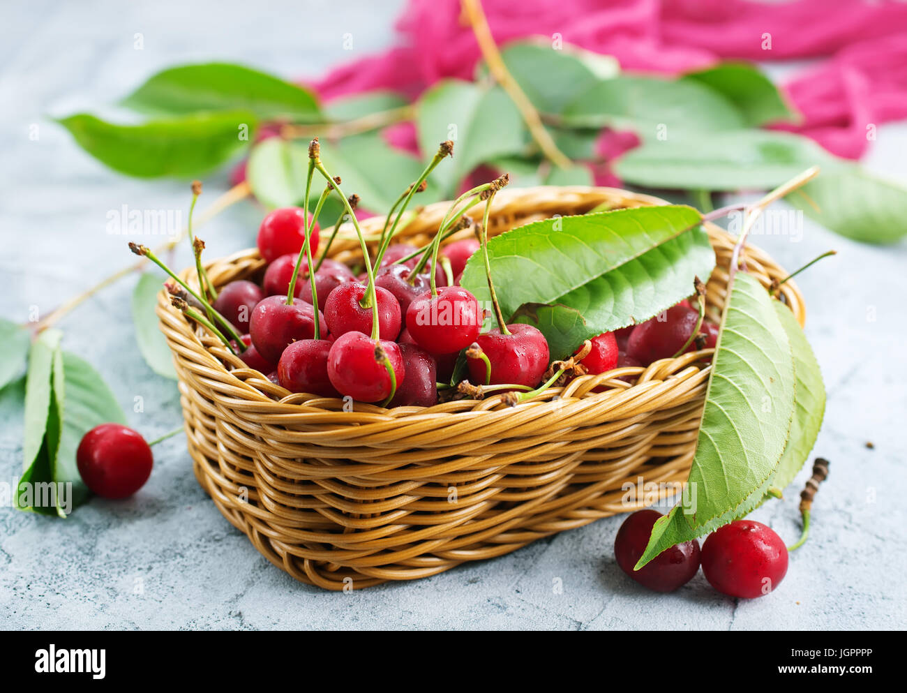 cherry in basket and on a table Stock Photo - Alamy