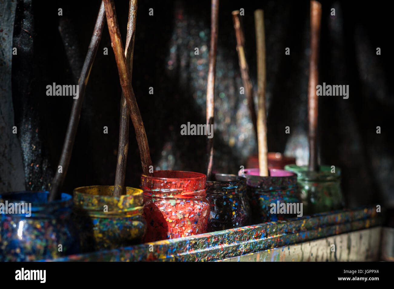 Paints and brushes.Ebru artist Coskun Uzunkaya at work in his studio at ...