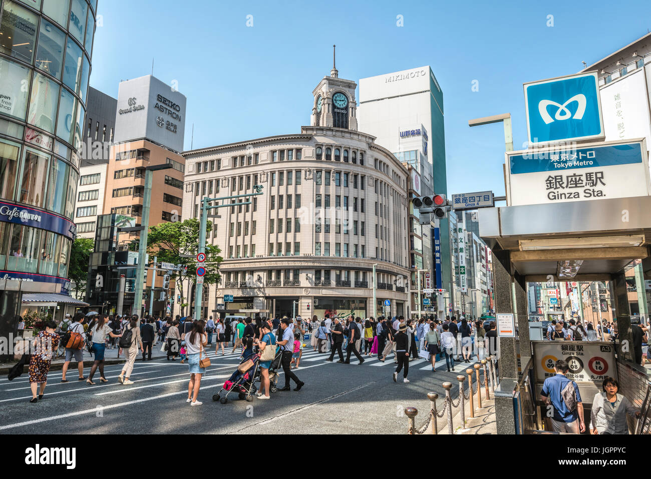 Tourists and locals are walking at a traffic free Sunday over Ginza Street, Tokyo, Japan Stock Photo