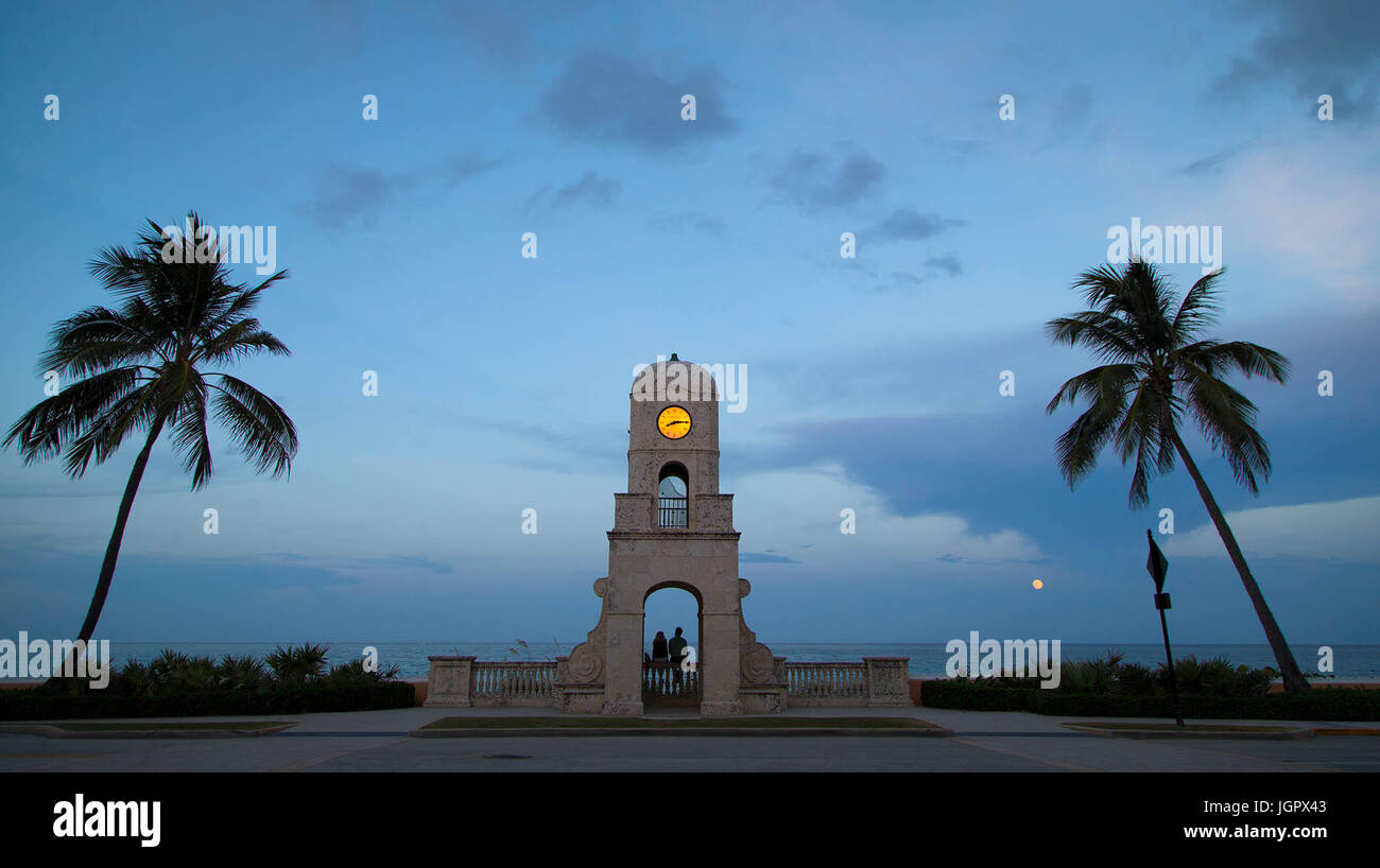 Wellington, Florida, USA. 9th July, 2017. Nicole Zelman, Coconut Creek and Matthew Leger, West Palm Beach, watch the thunder moon rise Saturday evening from the clock tower in Palm Beach, Florida on July 8, 2017. Native Americans referred to it as the ''Thunder Moon'', since thunderstorms are so prevalent in during July. Credit: Allen Eyestone/The Palm Beach Post/ZUMA Wire/Alamy Live News Stock Photo