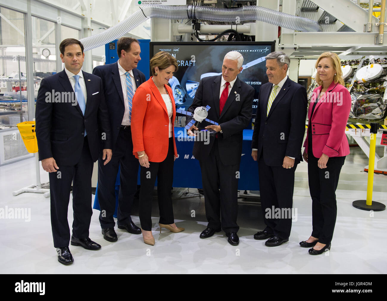 In this photo released by the National Aeronautics and Space Administration (NASA) United States Vice President Mike Pence receives a model of Orion from Acting NASA Administrator Robert Lightfoot, second from left, and NASA Kennedy Space Center (KSC) Director Robert D. Cabana, second from right, Thursday, July 6, 2017, while touring KSC's Operations and Checkout Building in Cape Canaveral, Florida. Also pictured are Sen. Marco Rubio (Republican of Florida), Marillyn Hewson, chairman, president and CEO of Lockheed Martin, third from left, and Janet Petro, KSC's deputy director, right. Mandator Stock Photo