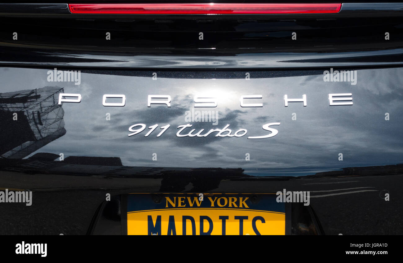 The back end of a black Porsche 911 Turbo S with a New York license plate Stock Photo