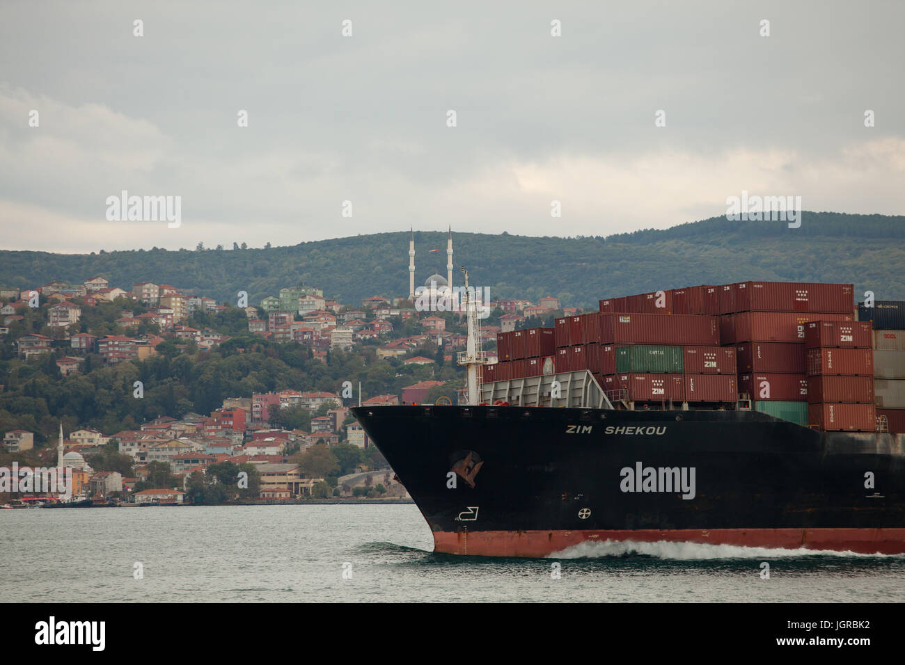 Cargo ship loaded with transport containers passes Bosphorus strait