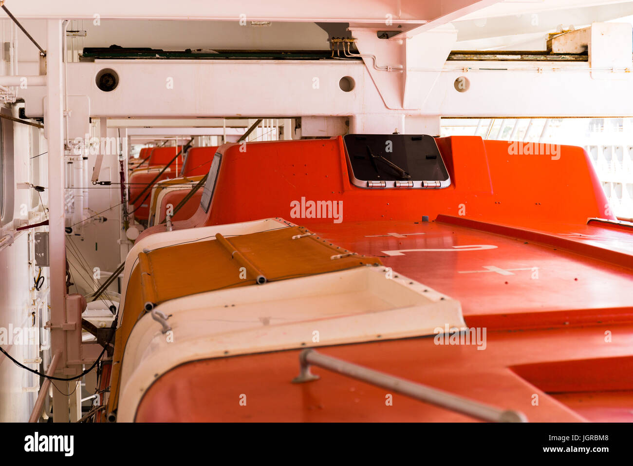 Stowed and secured lifeboats onboard modern British passenger ship Ventura Stock Photo