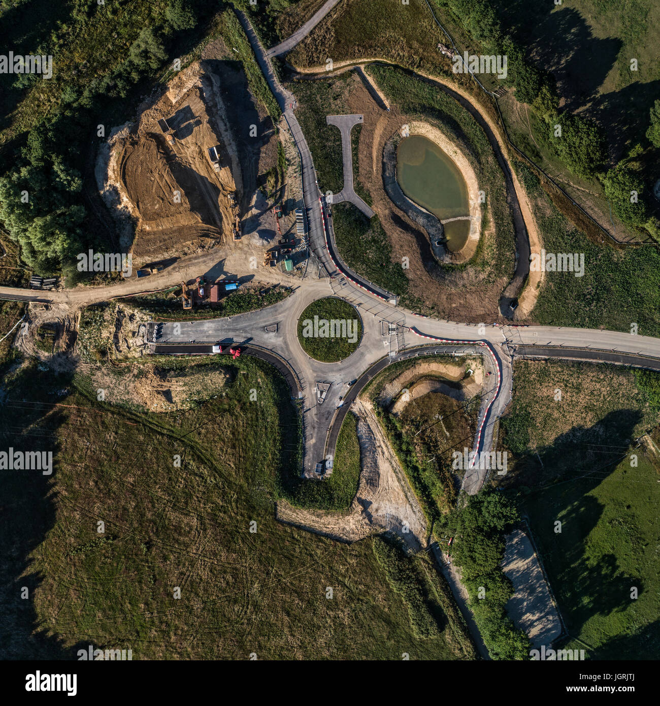 Aerial View of Bexhill North Access Road roundabout under development. Ground works and man made lake Stock Photo