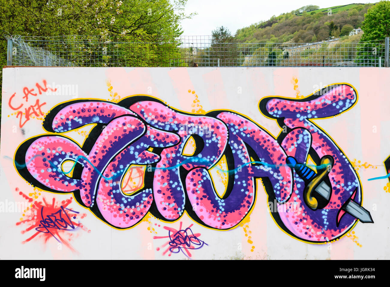 Graffiti covers the side of a wall in Calder Holmes Park, hebden Bridge Stock Photo