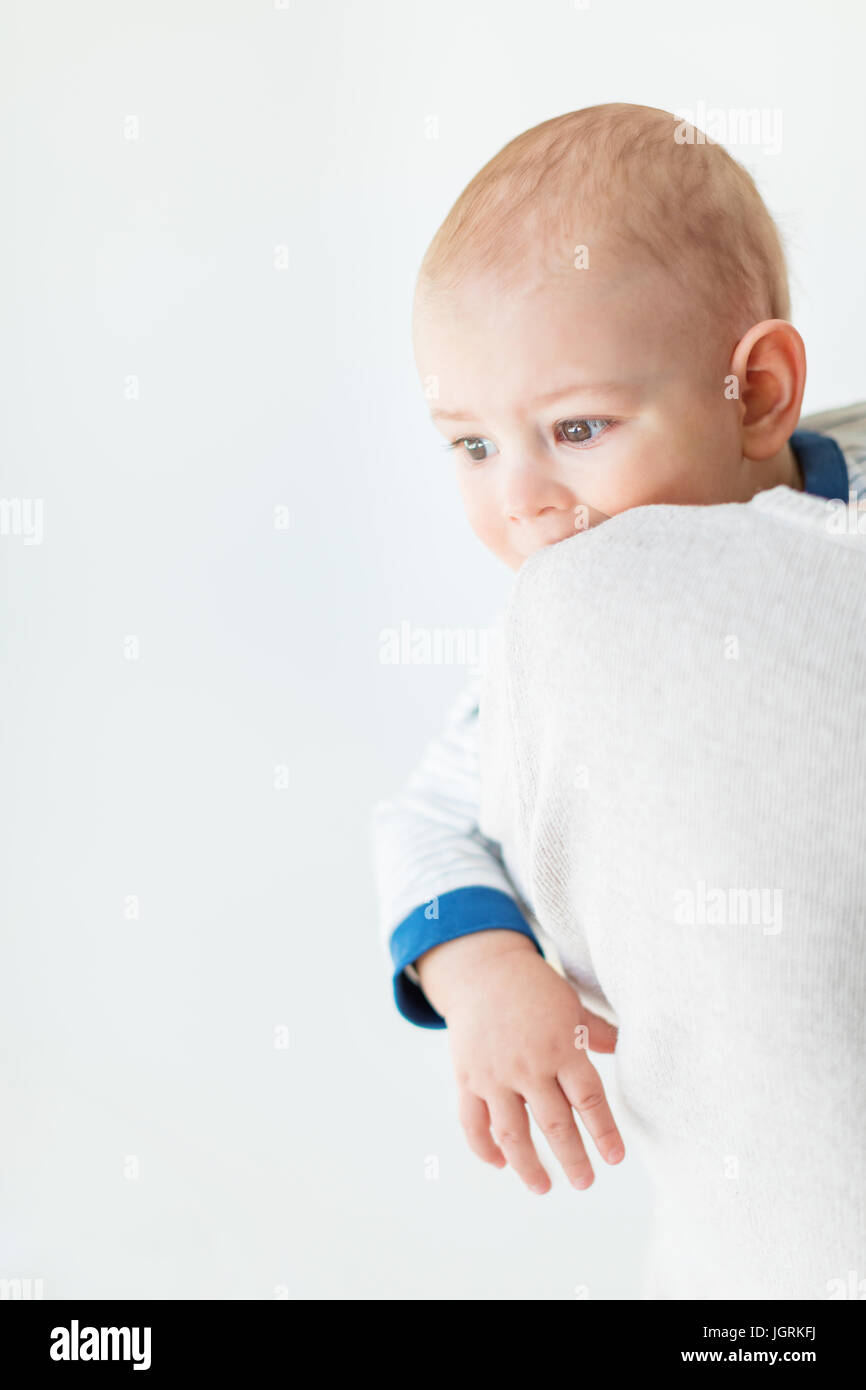 Portrait of adorable baby boy looking away isolated on white, 1 year old baby concept Stock Photo