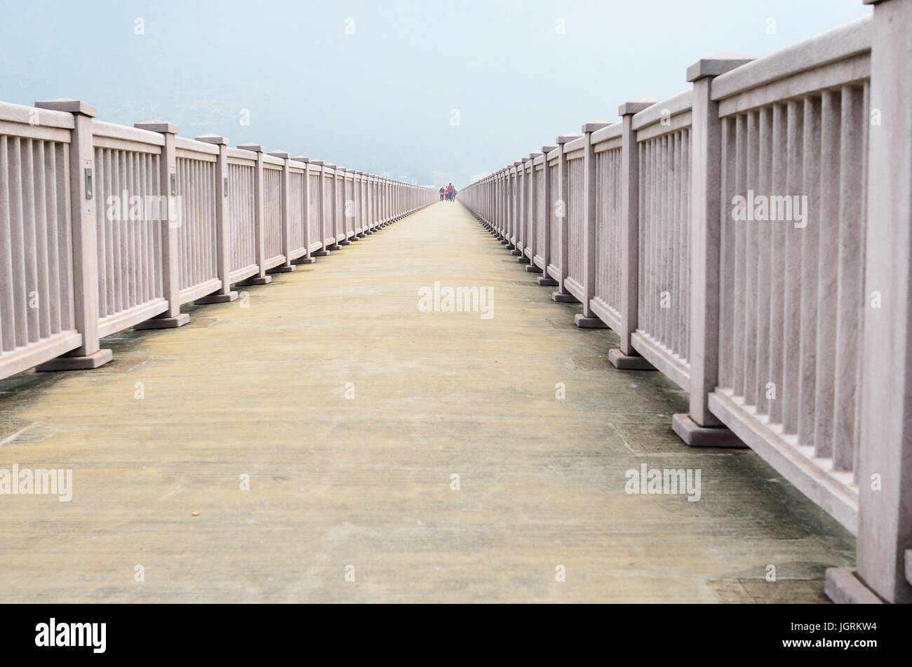 Long Road with Pink railing Stock Photo - Alamy