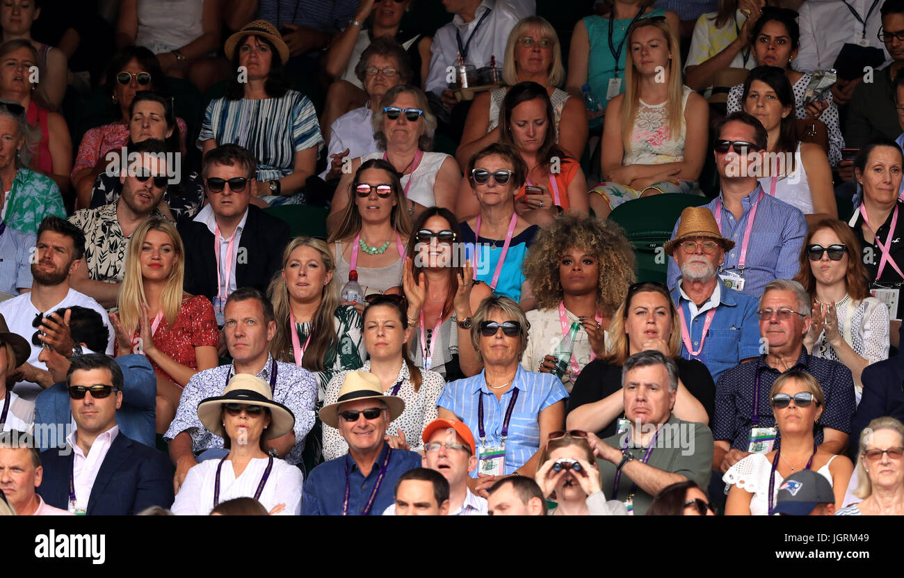 Rick Edwards (fourth row left), Joel Dommett (third row left), Hannah Cooper (third row second left), Lisa Snowdon (third row centre), Fleur East (third row centre right), Angela Scanlon (third row right) in the stands of centre court on day seven of the Wimbledon Championships at The All England Lawn Tennis and Croquet Club, Wimbledon. Stock Photo