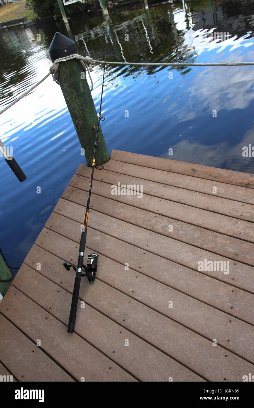 Fishing pole on dock Stock Photo