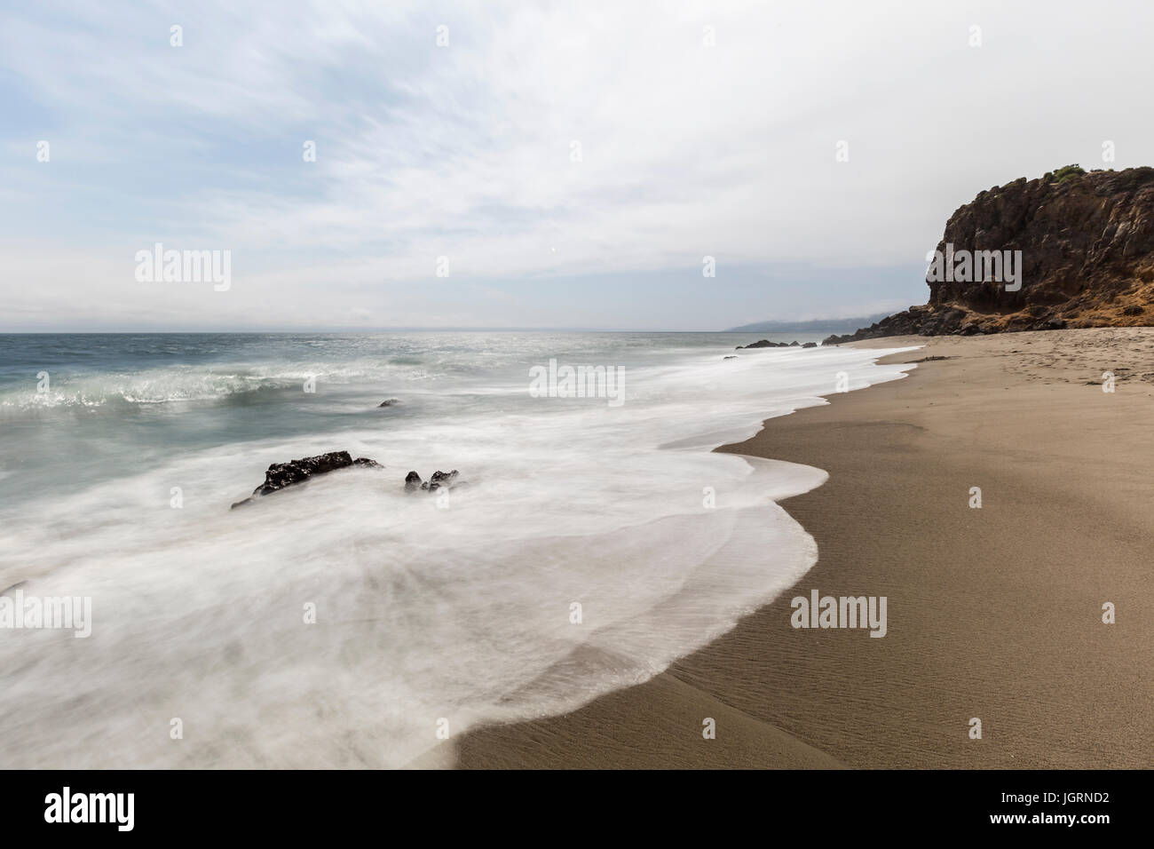 Secluded Pirates Cove Beach with motion blurred water at Point Dume State Park in Malibu, California. Stock Photo