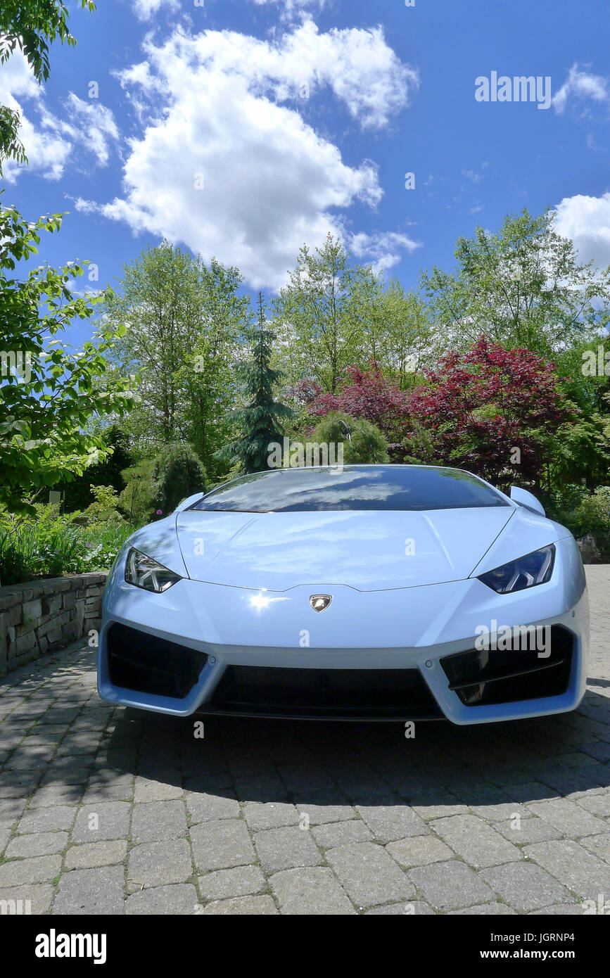 A baby blue Lamborghini huracan parked and on display at a Toronto