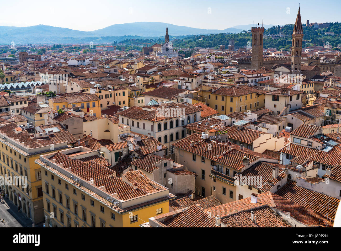City of Florence viewed from the dome of the cathedral of Santa Maria with Basilica of Santa Croce in the distance. Stock Photo