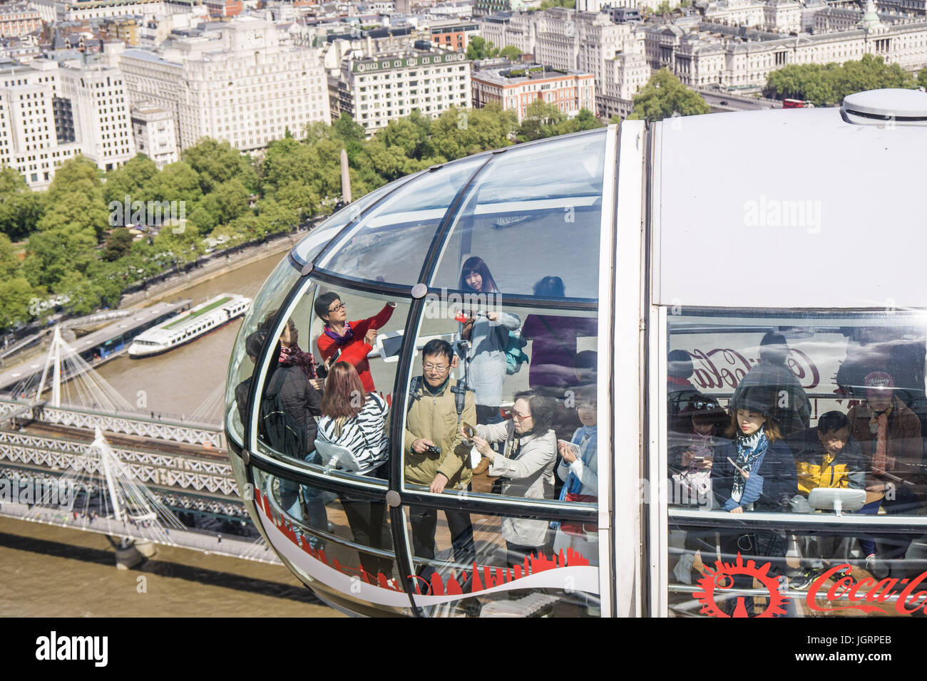 Chinese tourists enjoying the London Eye in Britain Stock Photo