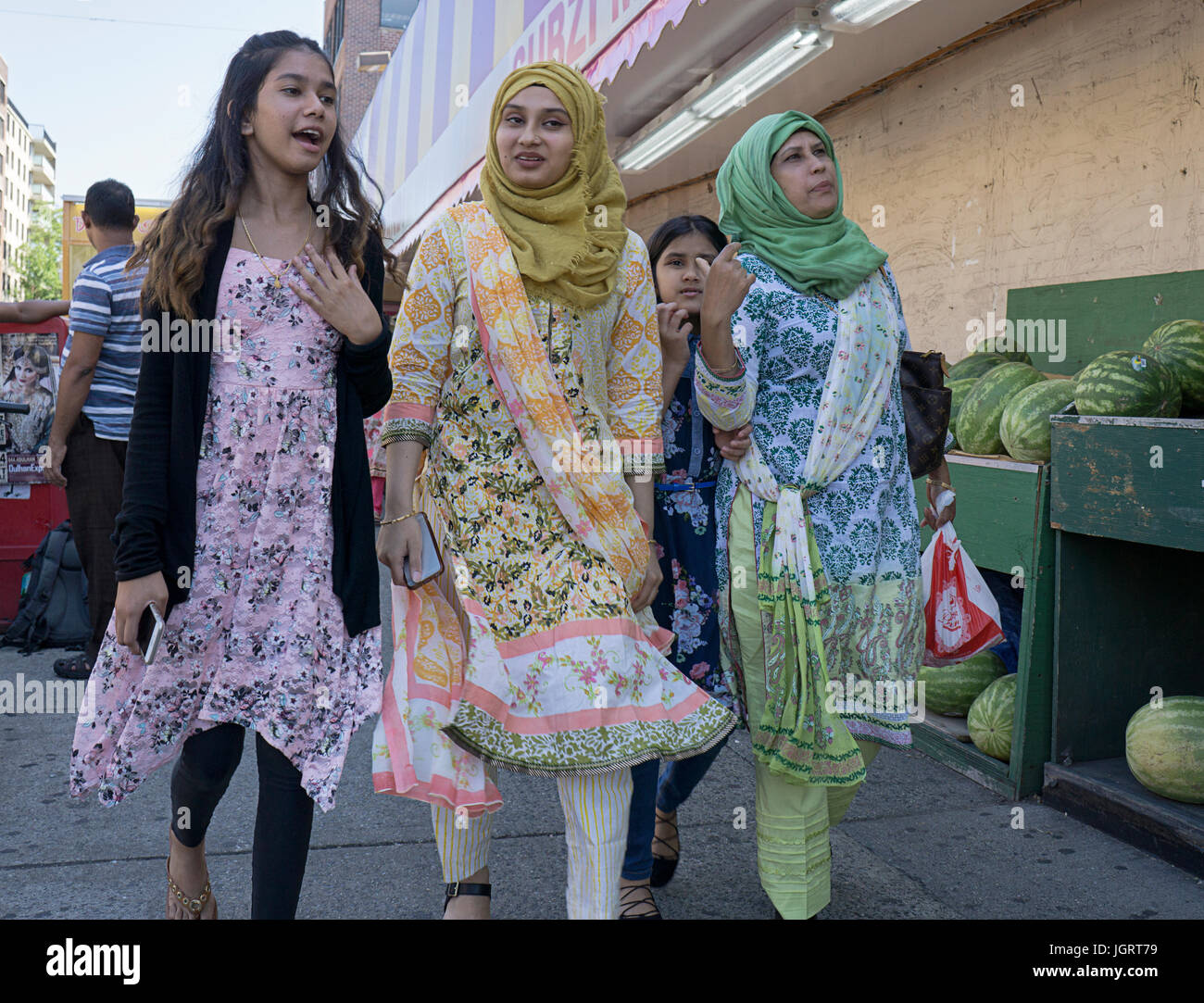 South Asian women walking on 73rd Street in Jackson Heights, Queens, New York City. Possibly a family. Stock Photo