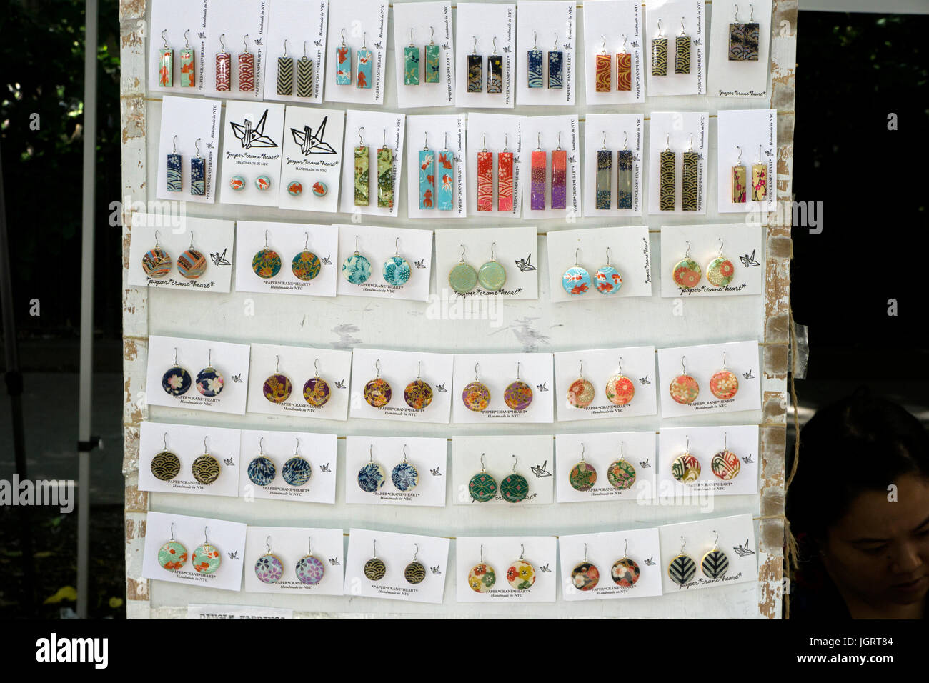 Japanese handmade earrings made out of paper for sale at a street fair in Greenwich Village, downtown Manhattan, New York City Stock Photo