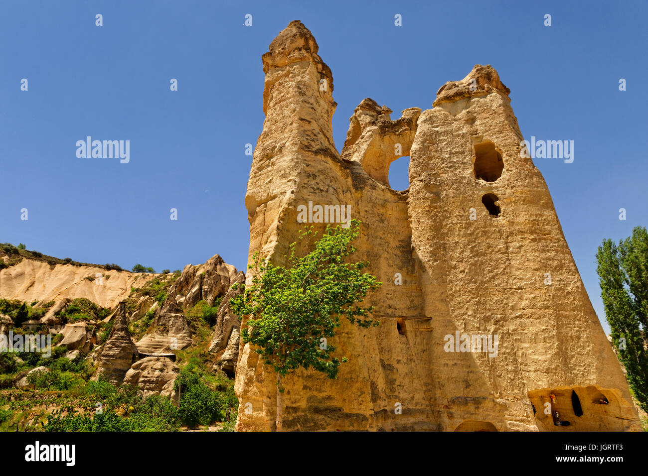 Cave dwellings and 'fairy chimneys' at Goreme National Park, Cappadocia, Turkey. Stock Photo