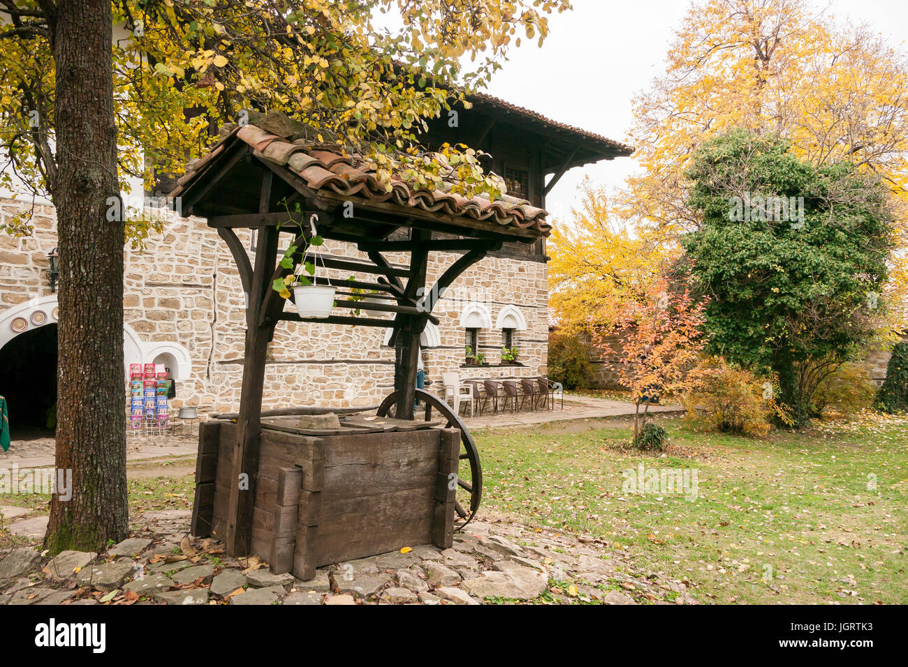 Water well with tiled roof in the garden a typical old house in Svishtov, Bulgaria Stock Photo
