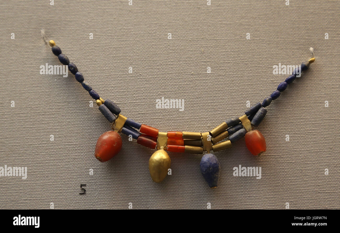 Necklace. Beads and bud pendants of gold, carnelian and lapis lazuli. British Museum. London. UK. Stock Photo