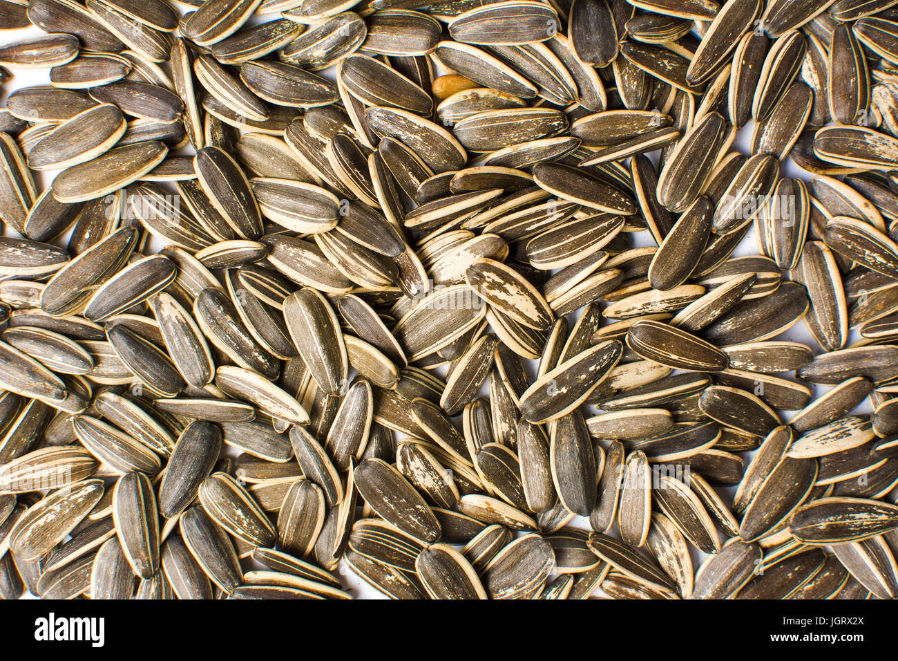 Flavored sunflower seeds on a pile background Stock Photo Alamy