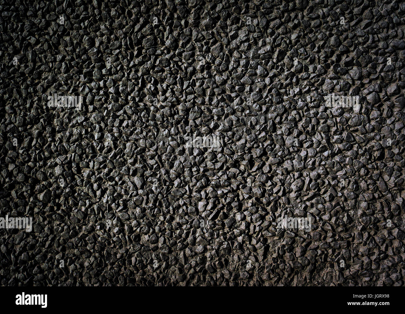black stone gravel background texture. background of small black pebbles Stock Photo