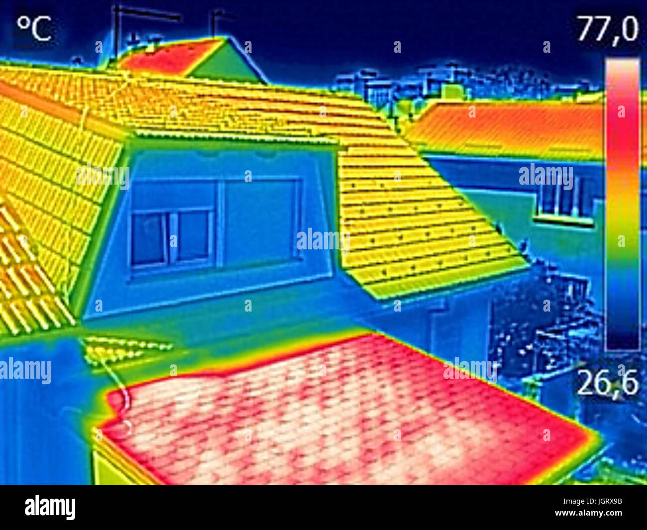 Infrared thermovision image showing, Warmed roofs on family homes Stock Photo