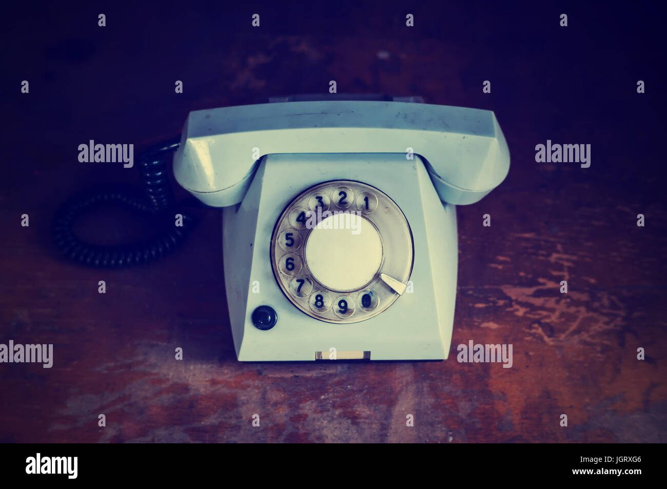 Retro background with rotary telephone on wood table Stock Photo - Alamy