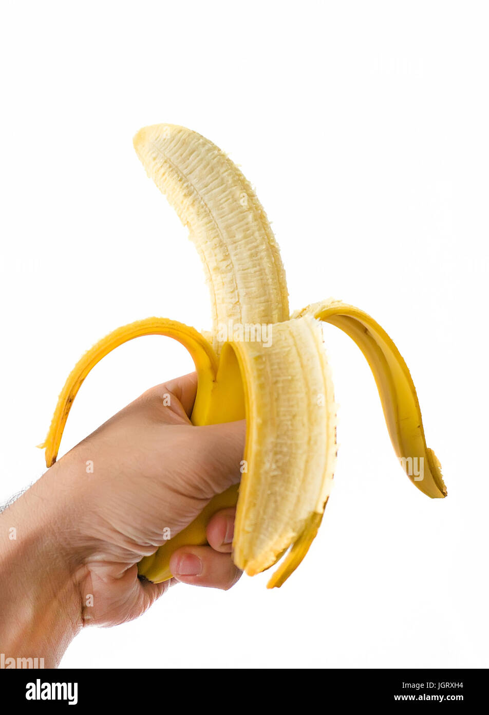 man hand holding banana isolated over white background Stock Photo