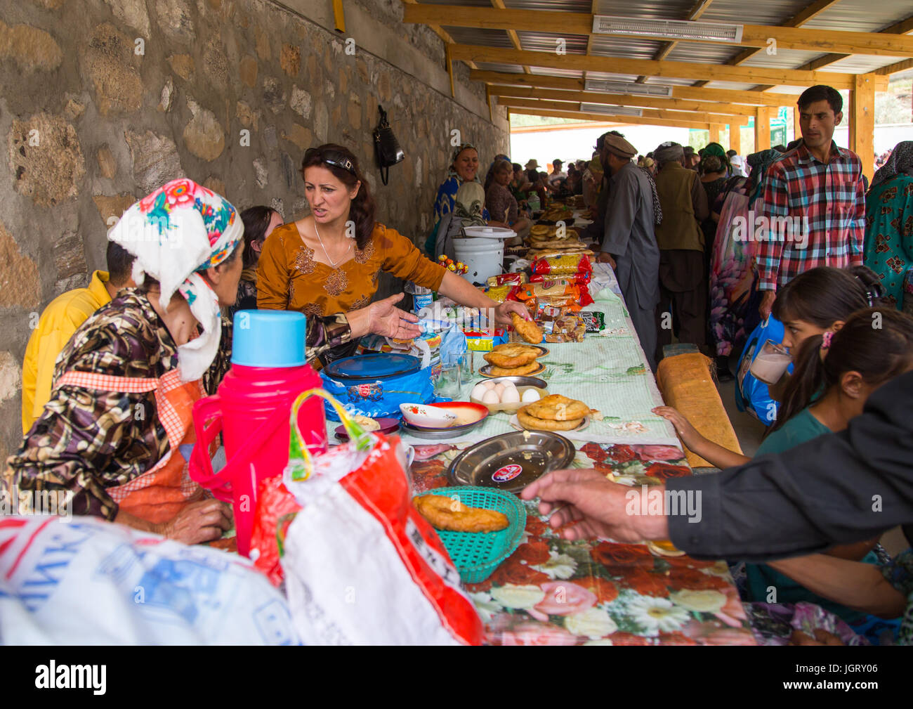 Tajik women selling food in the market border with Afghanistan, Central Asia, Ishkashim, Tajikistan Stock Photo