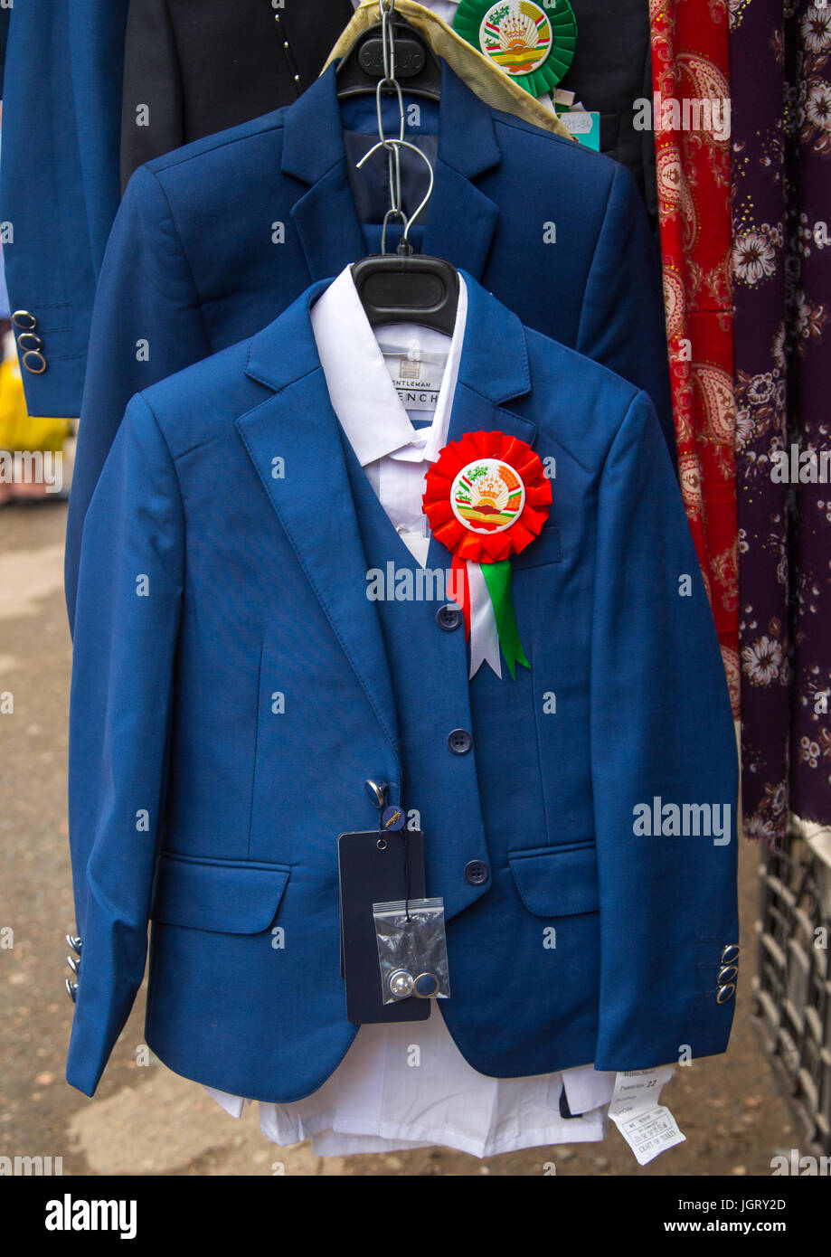 School uniforms for sale in a local market, Gorno-Badakhshan autonomous region, Khorog, Tajikistan Stock Photo