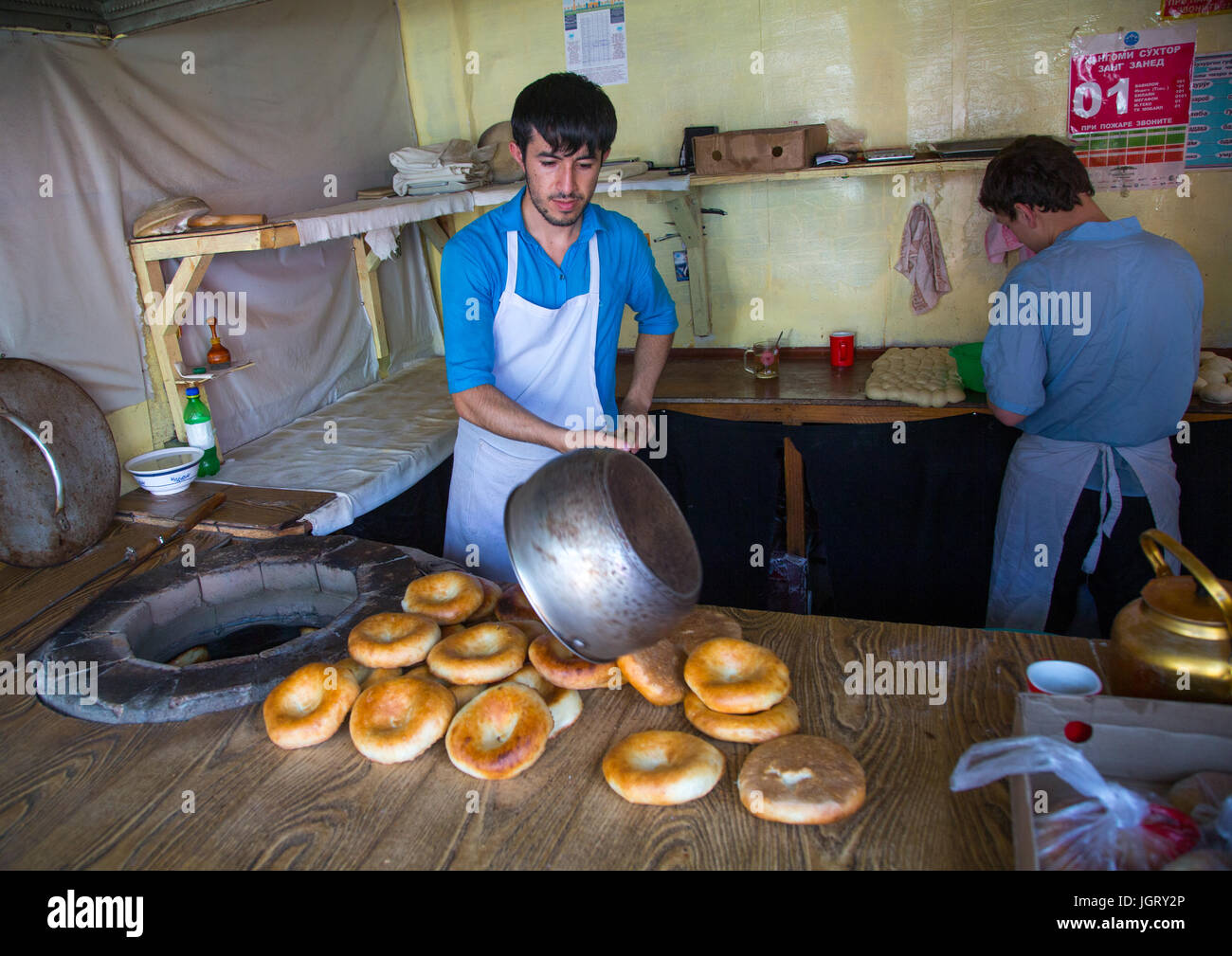 Tajik men making bread in a local bakery, Gorno-Badakhshan autonomous region, Khorog, Tajikistan Stock Photo