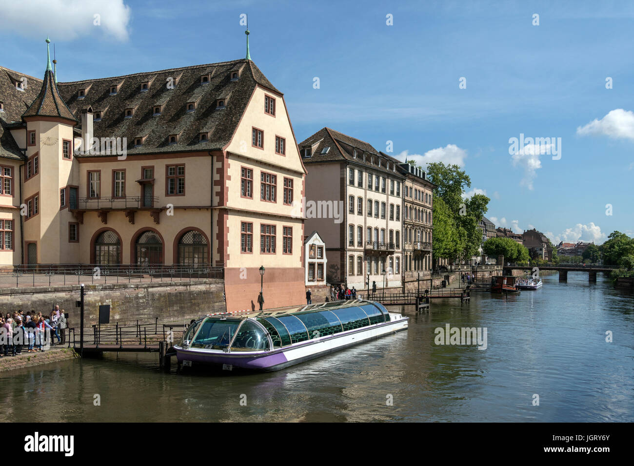 Tourist boat and old buildings in the historic city of Strasbourg in the Alsace region of France. This area of the city is a UNESCO World Heritage Sit Stock Photo
