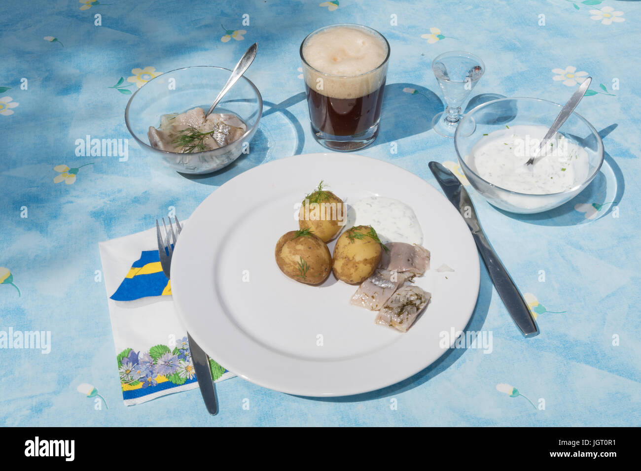 Traditional swedish midsummer dish with potatoes and marinated herring Stock Photo