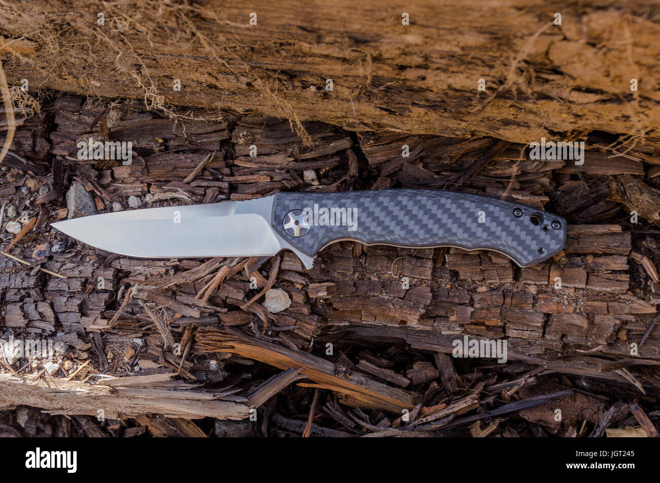 Zero tolerance knife with black knife. Wood background Stock Photo Alamy