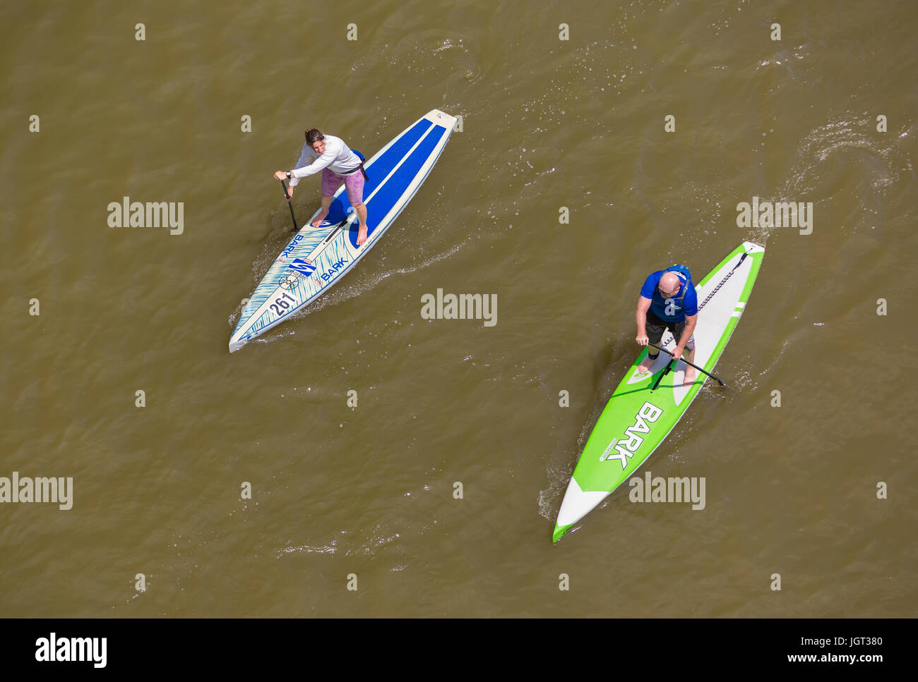 WASHINGTON, DC, USA - Two people paddling their paddleboards on the Potomac River. Stock Photo