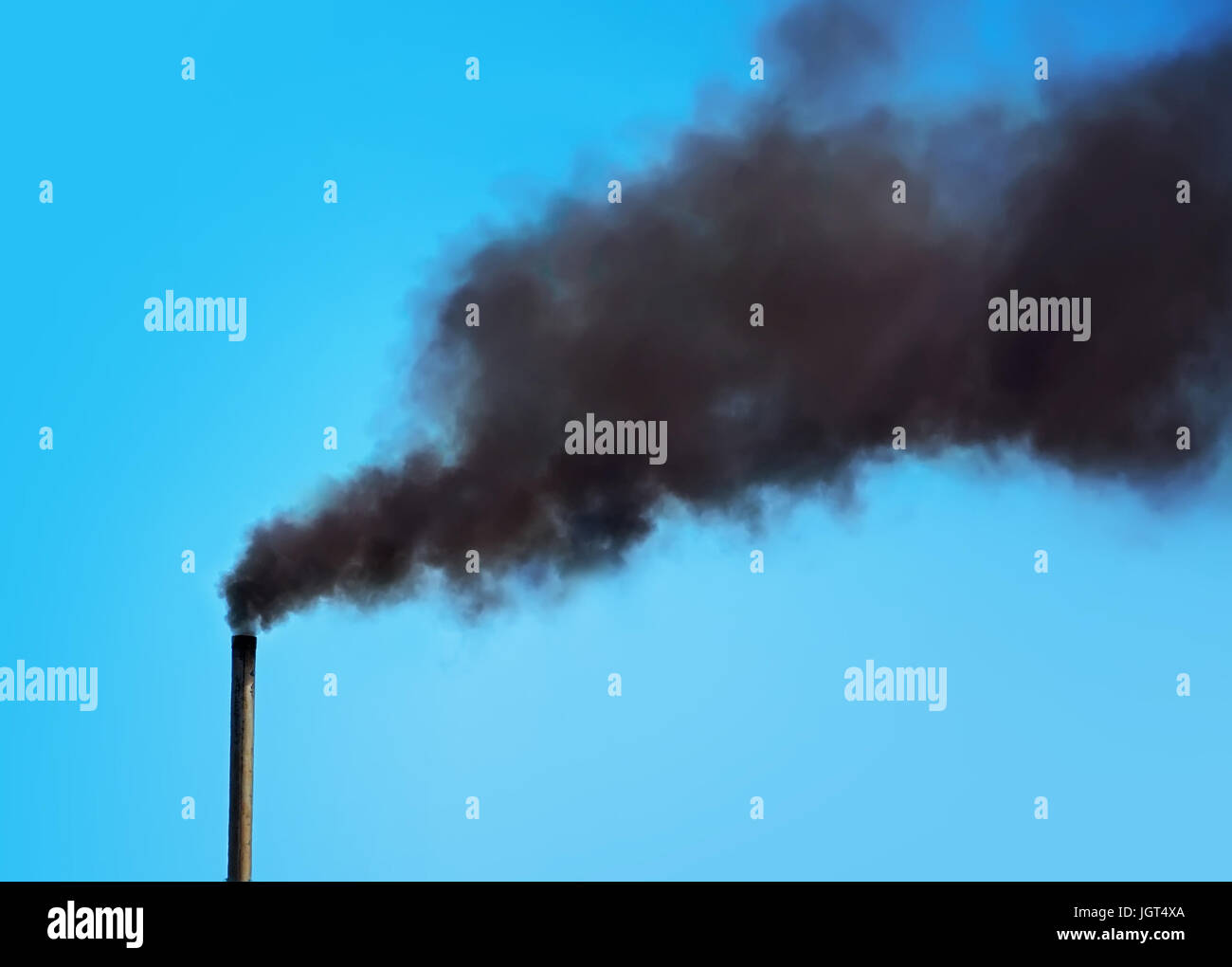 Black pipe with black smoke. Factory chimney smoking, heavy black smoke on the sky. ecology problems Stock Photo