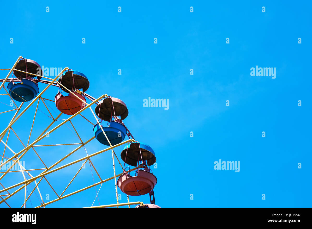 Wheel of review in the park on blue sky background Stock Photo