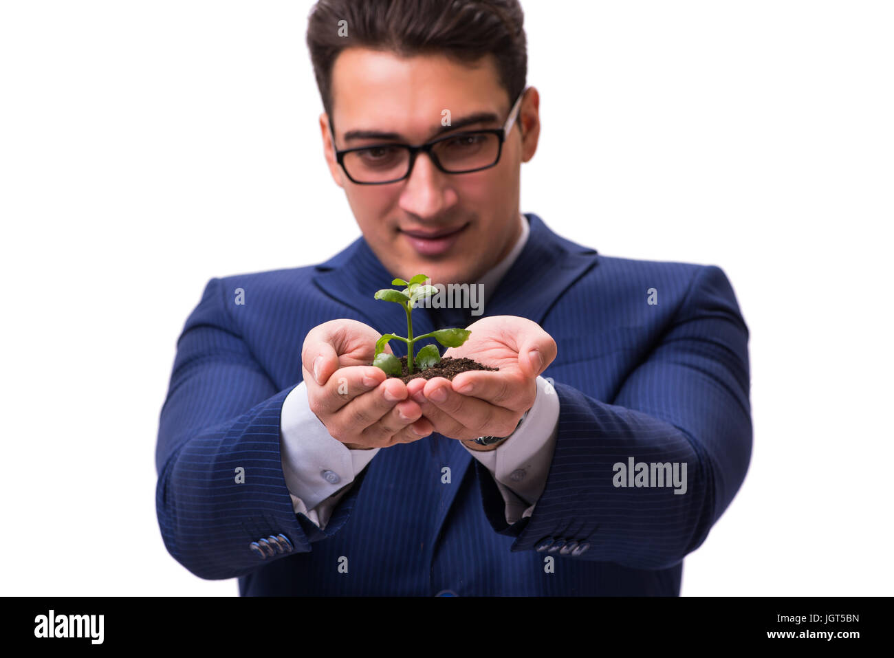 Businessman holding green sprouts isolated on white Stock Photo - Alamy