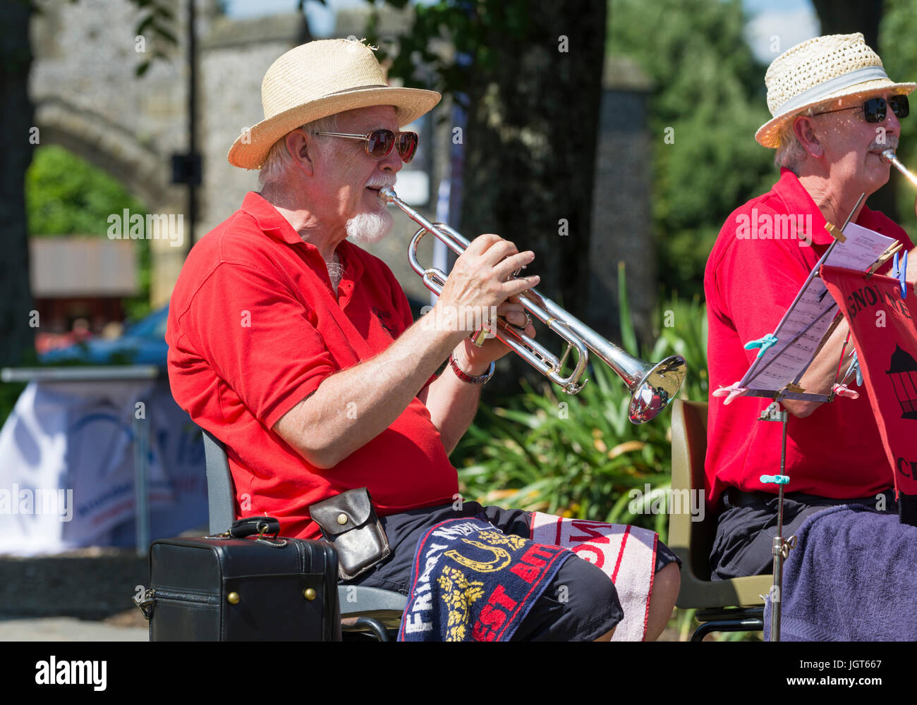 Trumpeter. Elderly man playing a flute with the Bognor Regis Concert Band at a Summer charity event. Stock Photo