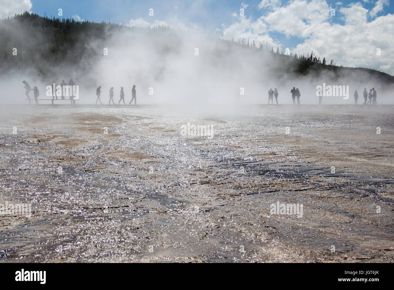 People on the boardwalk next to Grand Prismatic Spring, Midway Geyser Basin, Yellowstone National Park Stock Photo
