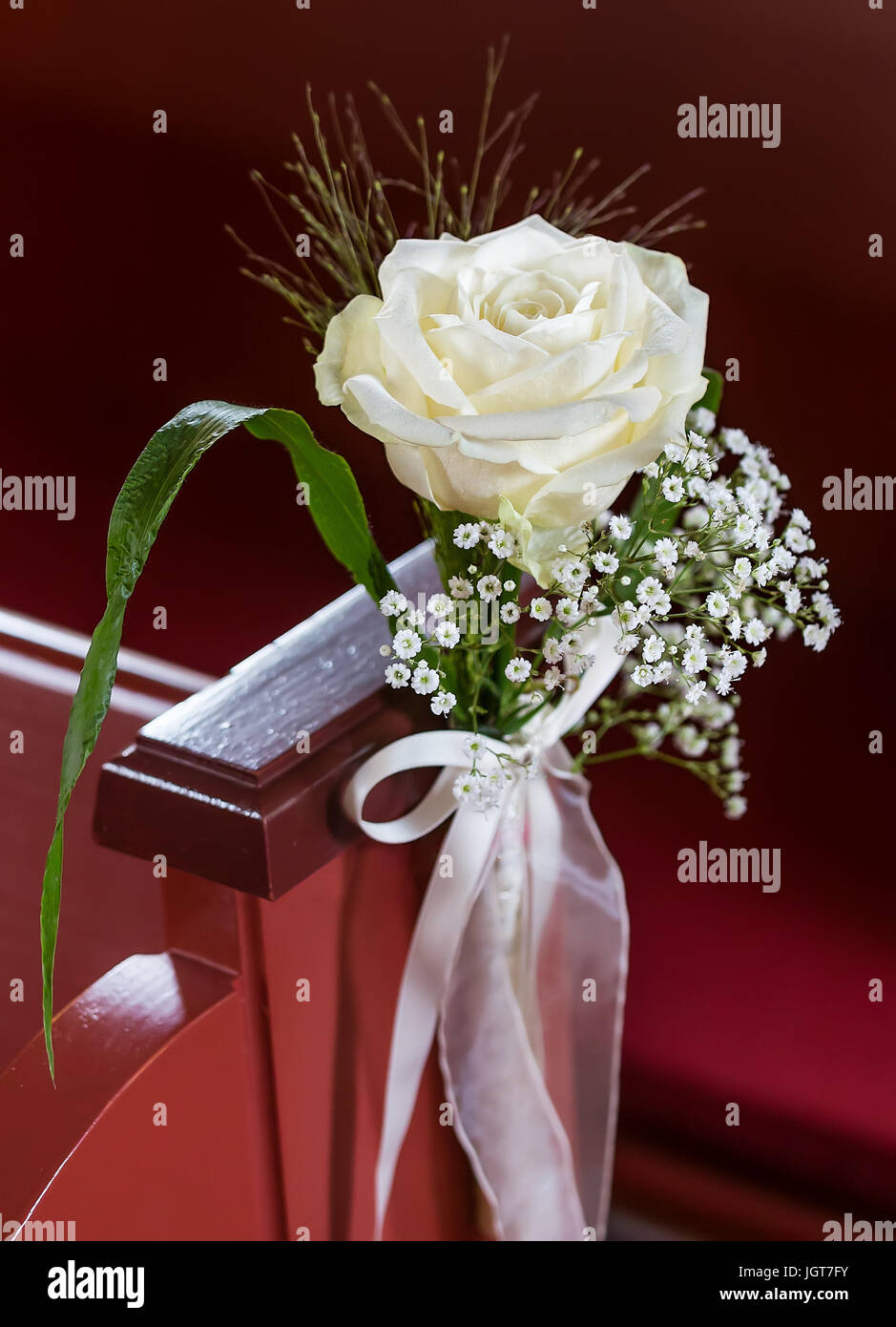 A flower bouquet of cream roses and chrysanthemums on the windows in the  church as a decoration of the holiday. Professional floristics Stock Photo  - Alamy