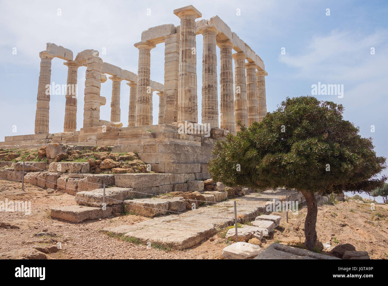 The Poseidon Temple with an olive tree at Cape Sounion Stock Photo