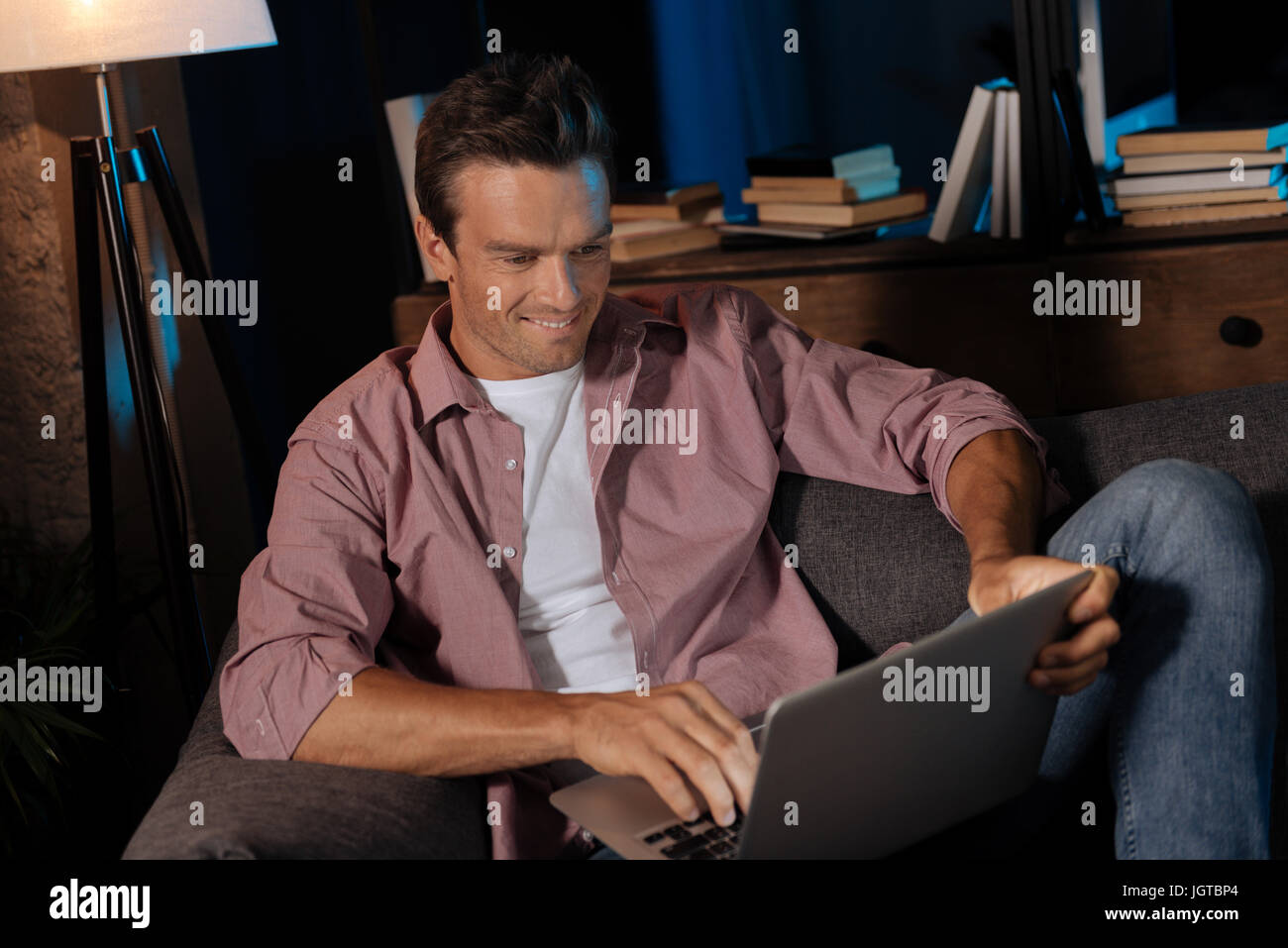 Sociable Pleasant Guy Typing A Message Stock Photo Alamy