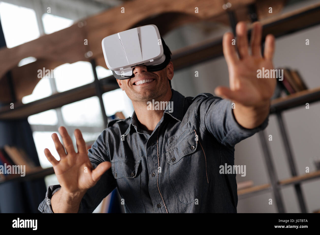 Enthusiastic curious man seeing the future of gaming Stock Photo