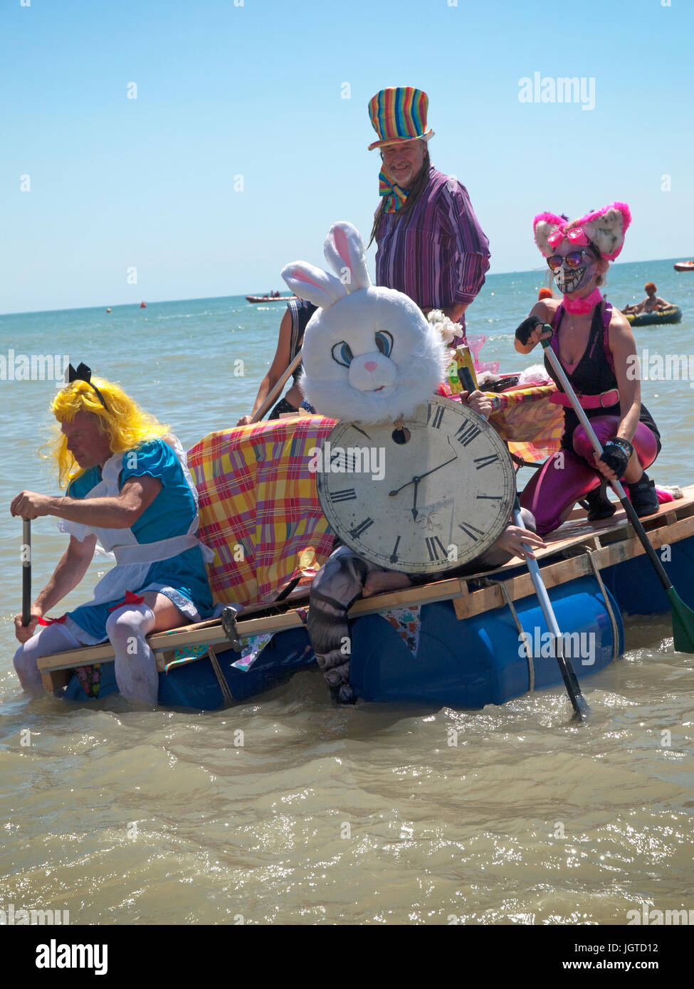 An Alice in Wonderland themed raft in the Paddle Around The Pier event, held in Brighton Stock Photo