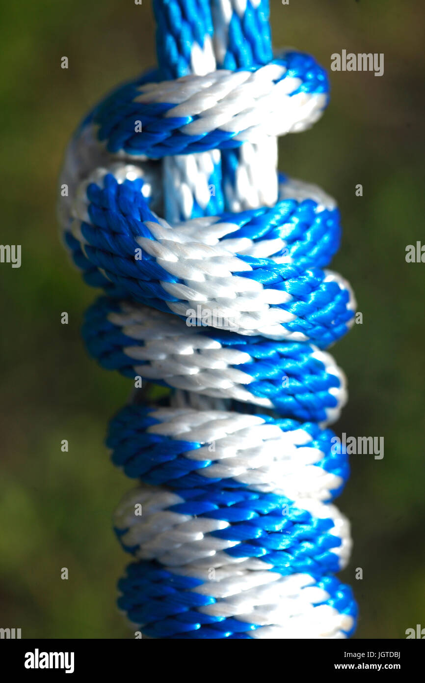 blue white colored rope with knot Stock Photo