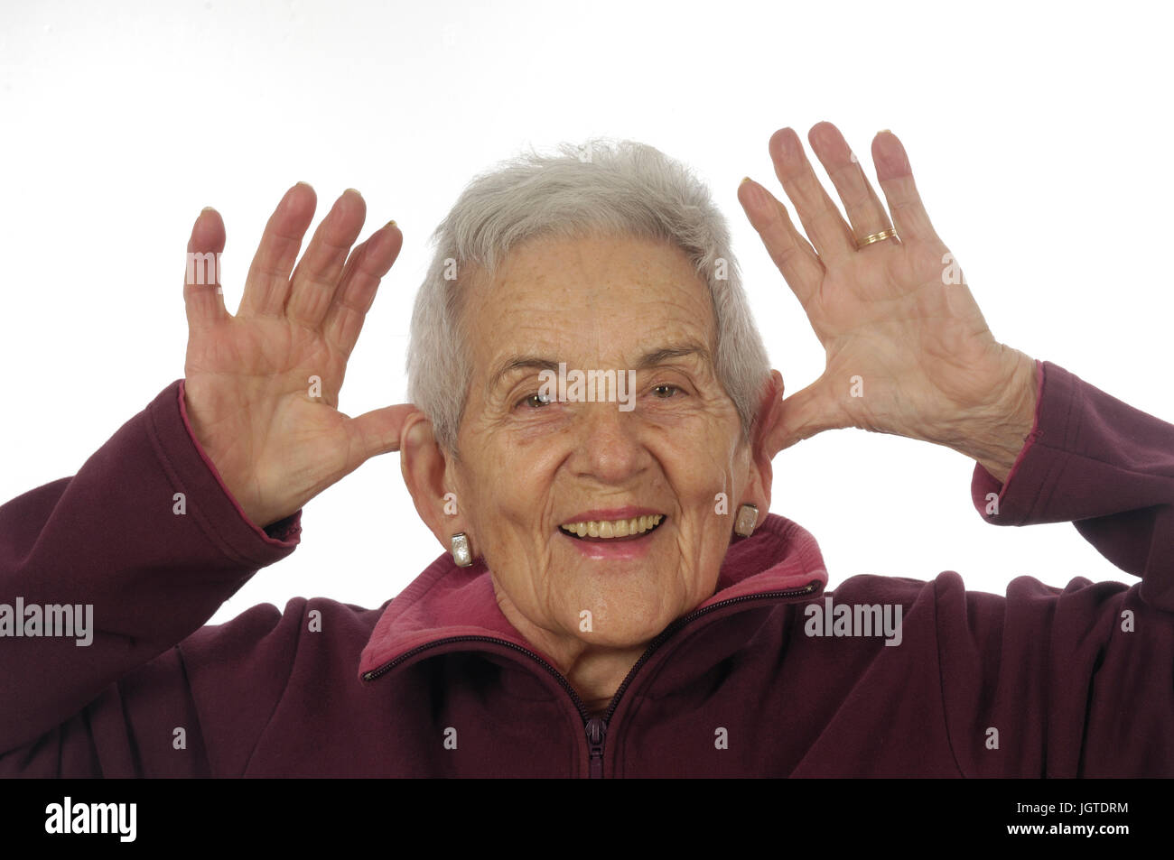 senior woman with hands on ears, mocking Stock Photo